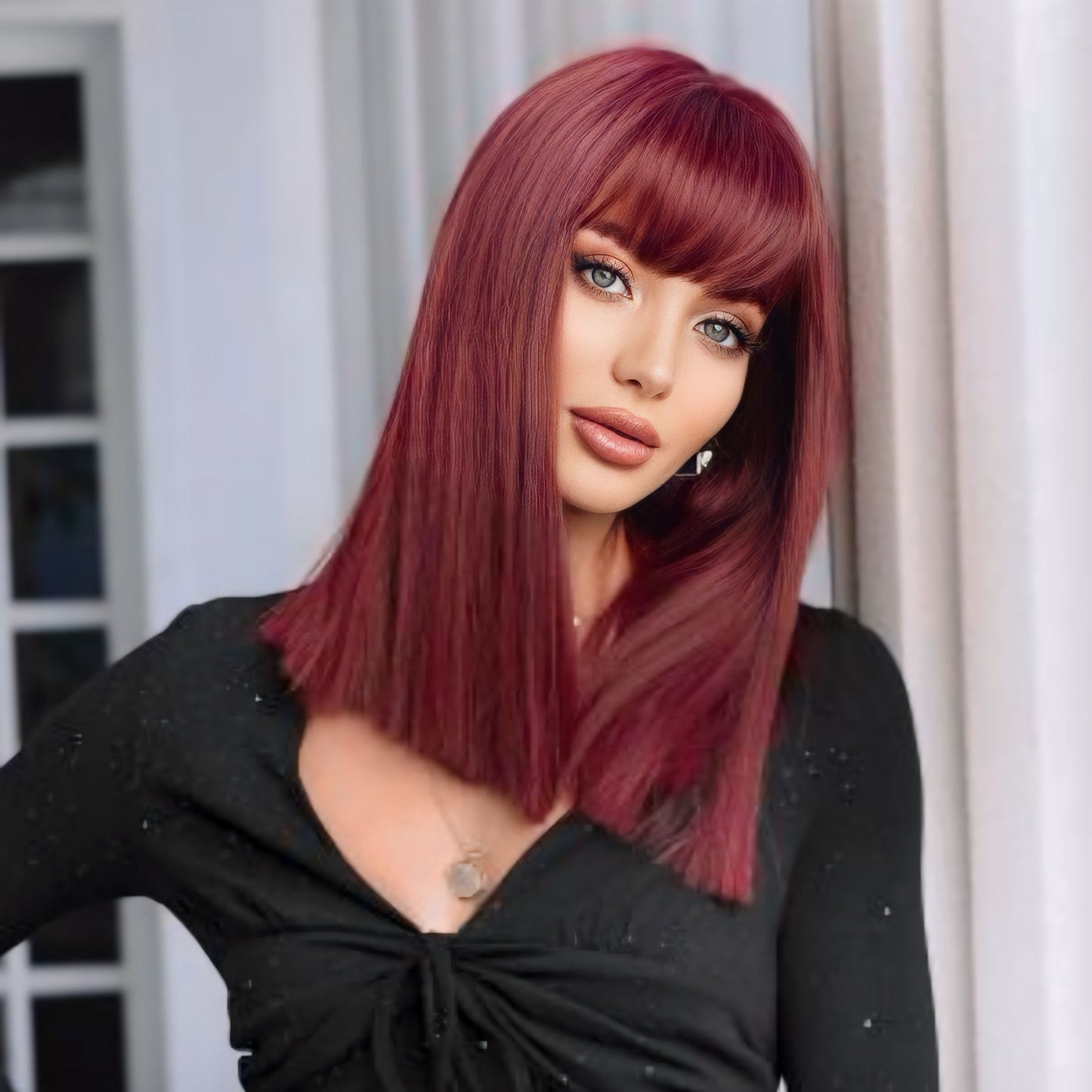 Burgundy synthetic wig with natural-looking parting, adjustable cap for comfort, 18 inches long.