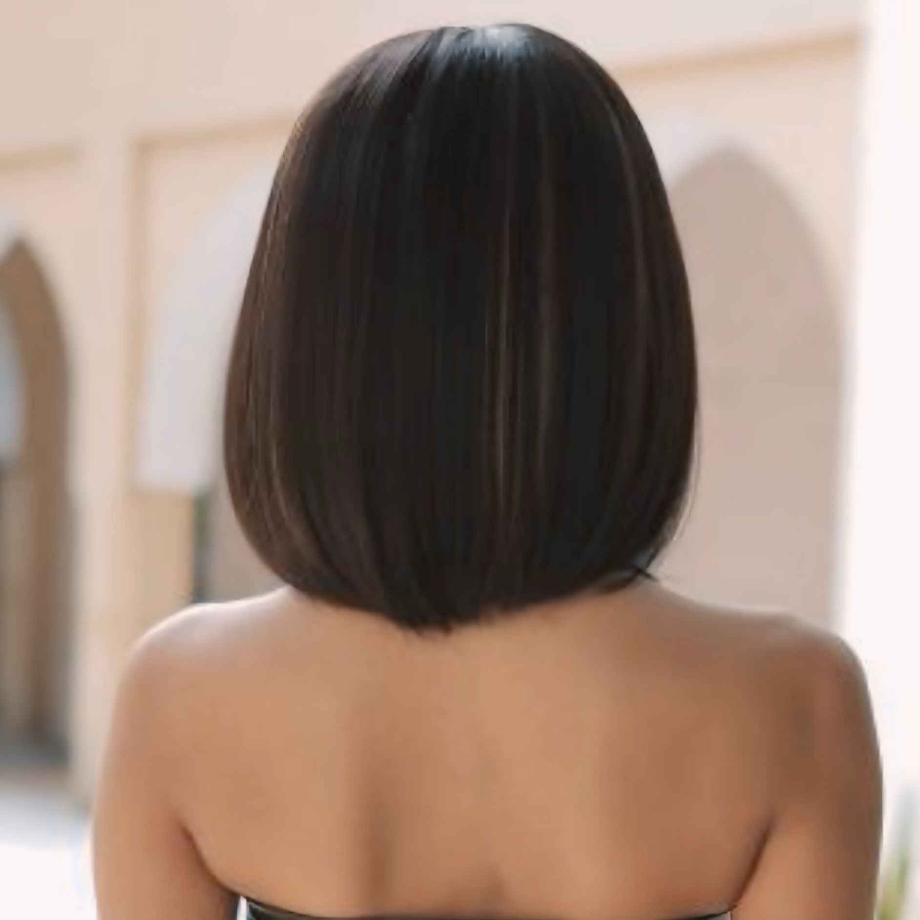 Close-up of a brunette bob wig with a natural-looking hairstyle and fixed hair parting, styled with straight, smooth hair and an adjustable breathable cap.