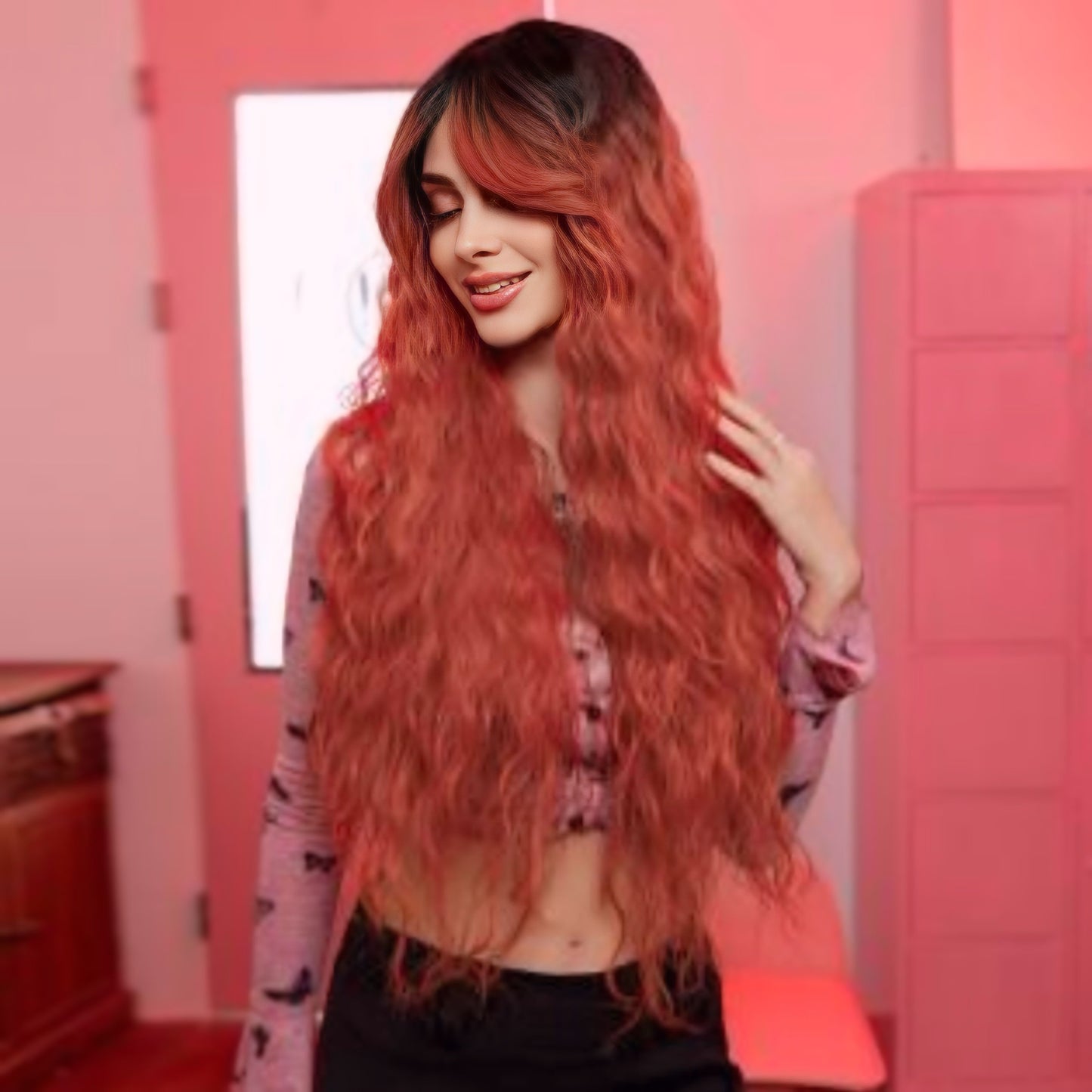 Heat-resistant synthetic wig in coral wavy style, designed with bangs and a comfortable, adjustable cap.