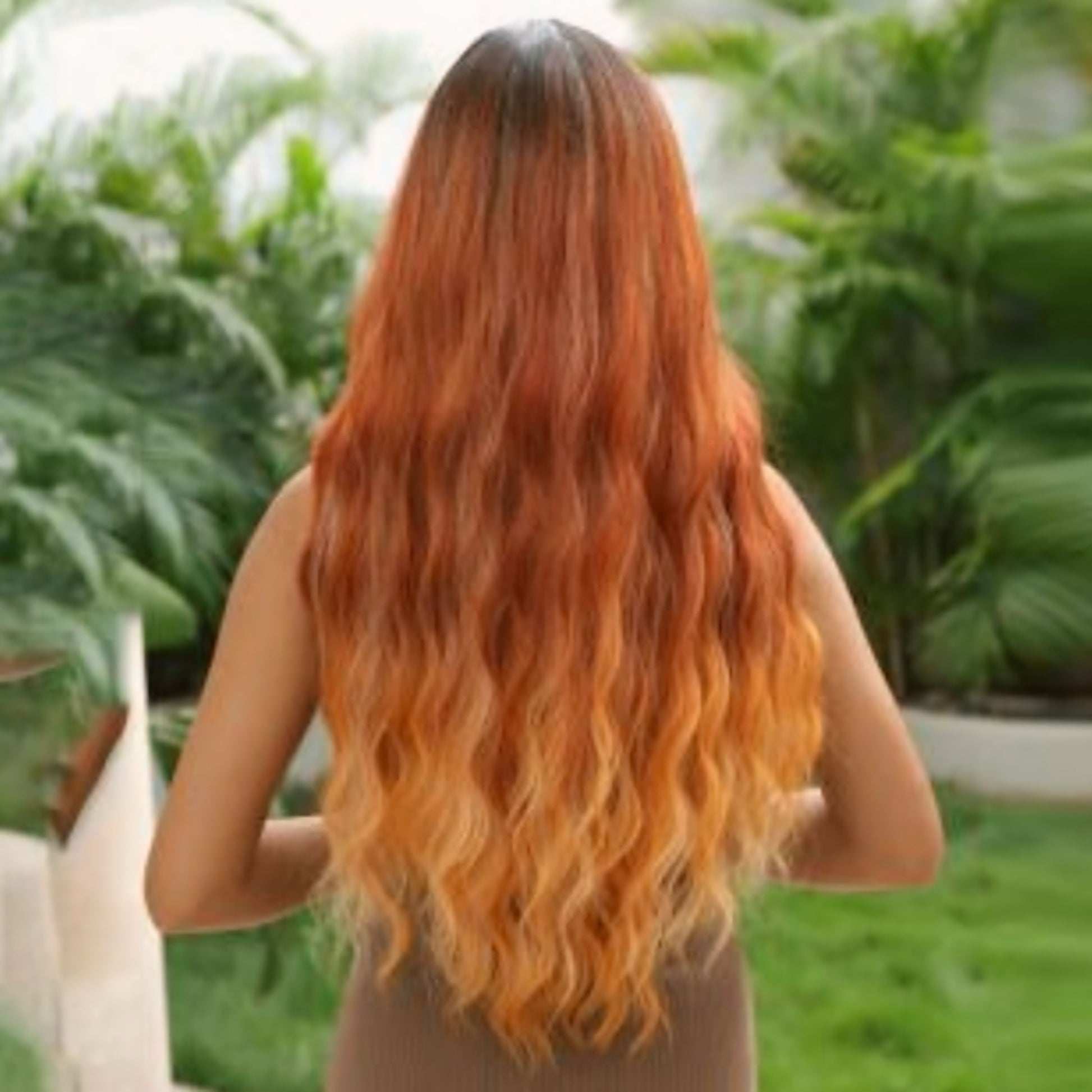 Heat-resistant synthetic wig in red and copper tones, featuring soft bangs and an adjustable breathable cap for a perfect fit.