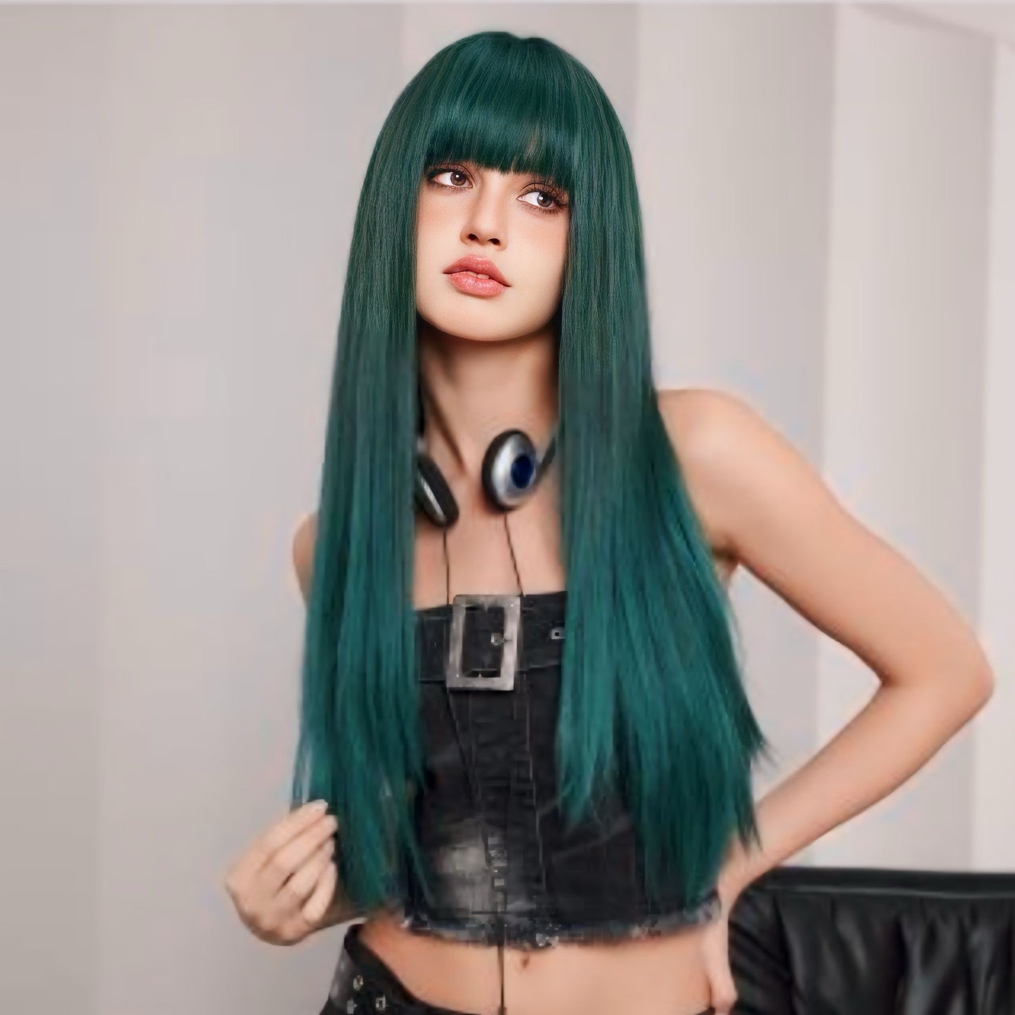 Model wearing a 28-inch dark green synthetic wig, showcasing its long length and natural appearance at a party