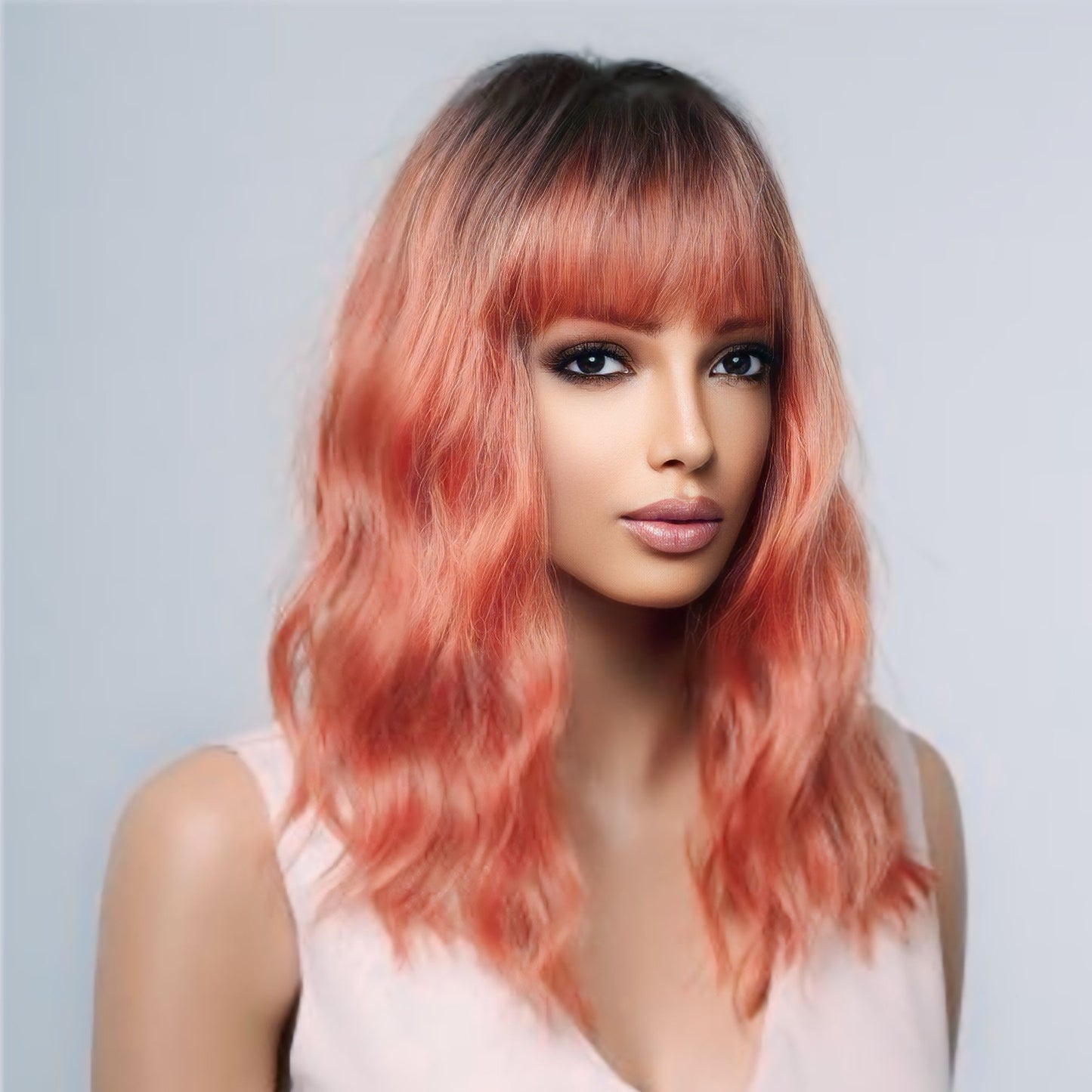 Stylish Rooted Coral Wavy Synthetic Wig with Fixed Parting, Bangs, and 130% Density for a Full, Natural Look