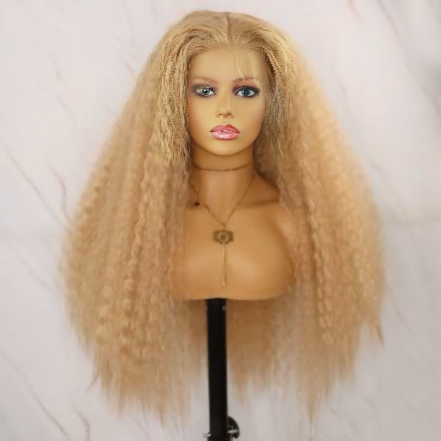 Textured Curly Blonde Synthetic Lace Front Wig displayed on a mannequin, showcasing natural-looking curls and a comfortable fit.