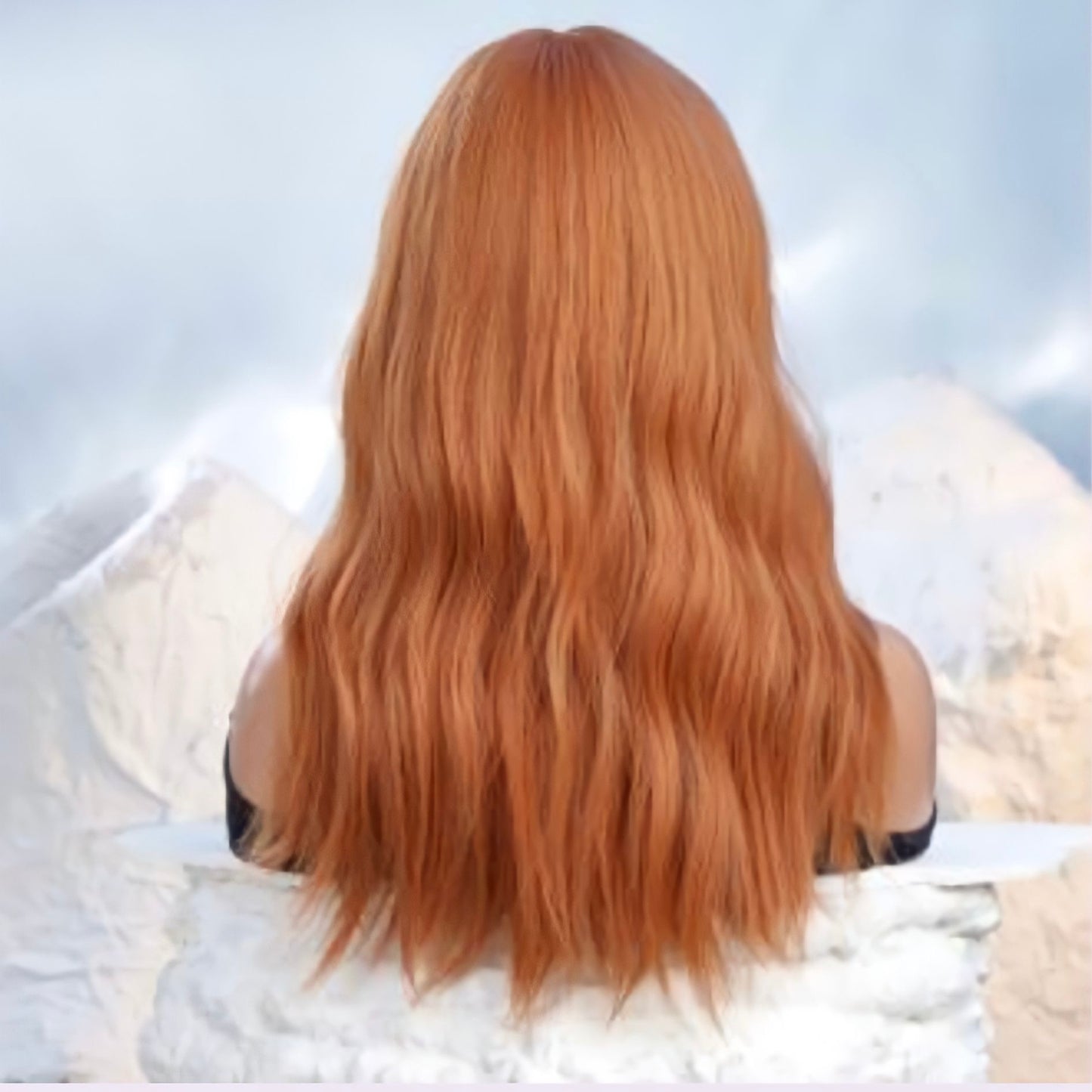 22-inch Ginger Loose Wavy Wig made of heat-resistant synthetic fiber, styled with bangs