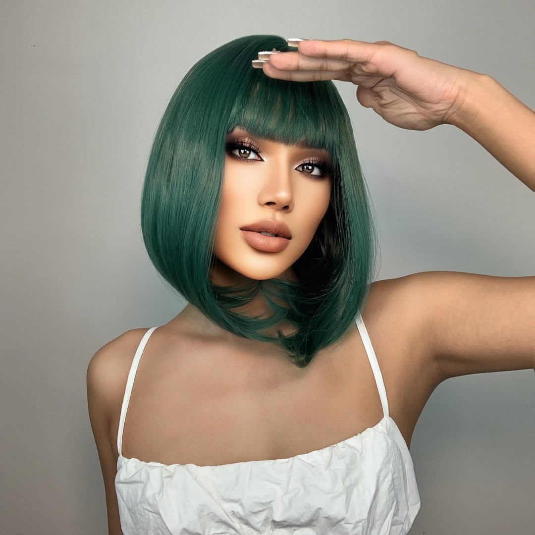 Model wearing a Dark Green Bob Synthetic Lace Front Wig, featuring 14 inches of smooth, stylish hair and natural-looking bangs